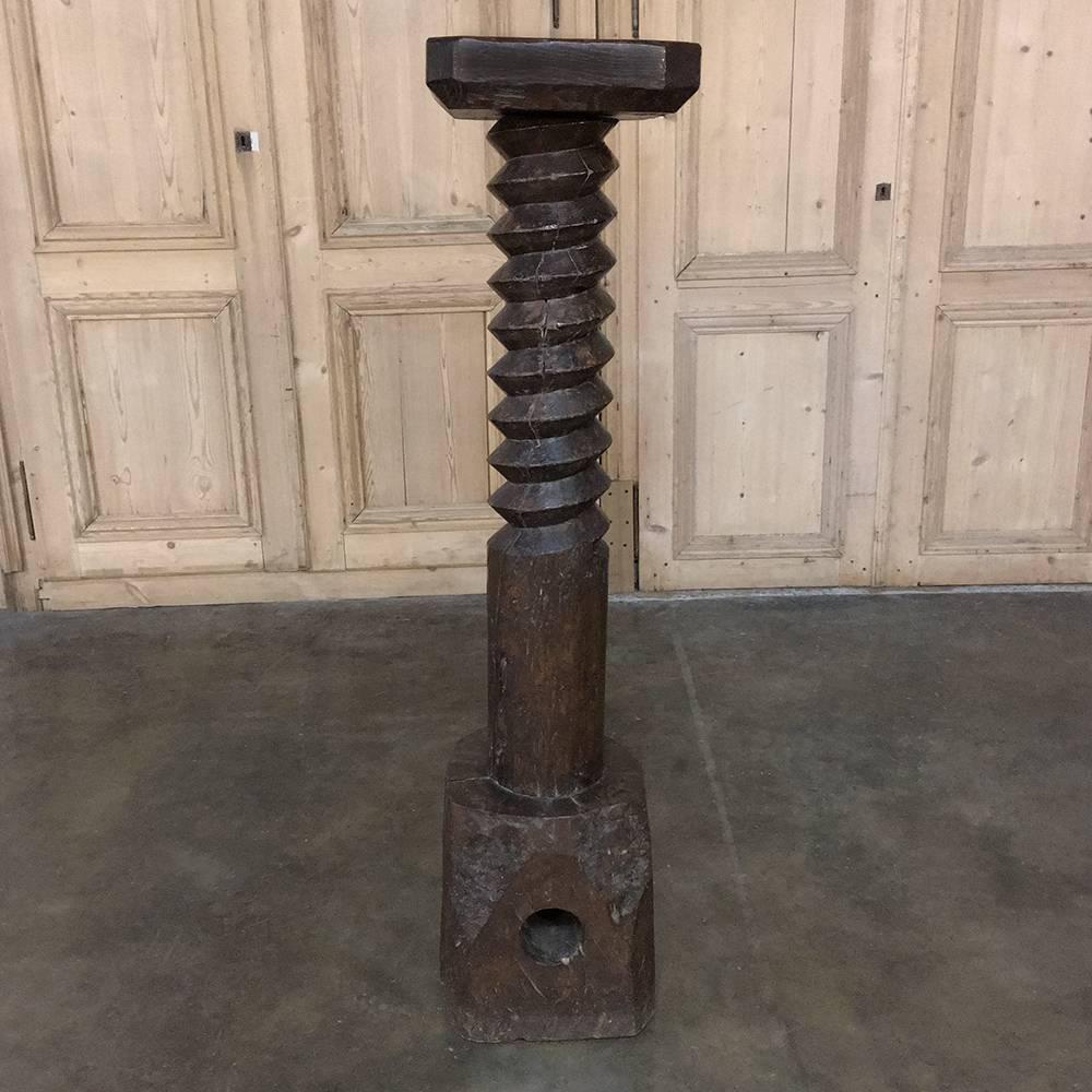 18th century rustic wine press pedestal is a reminder of a bygone era, when grapes were pressed for their precious juice with handmade wooden screws after the design of Archimedes himself! Repurposed to create a stunning pedestal perfect for your