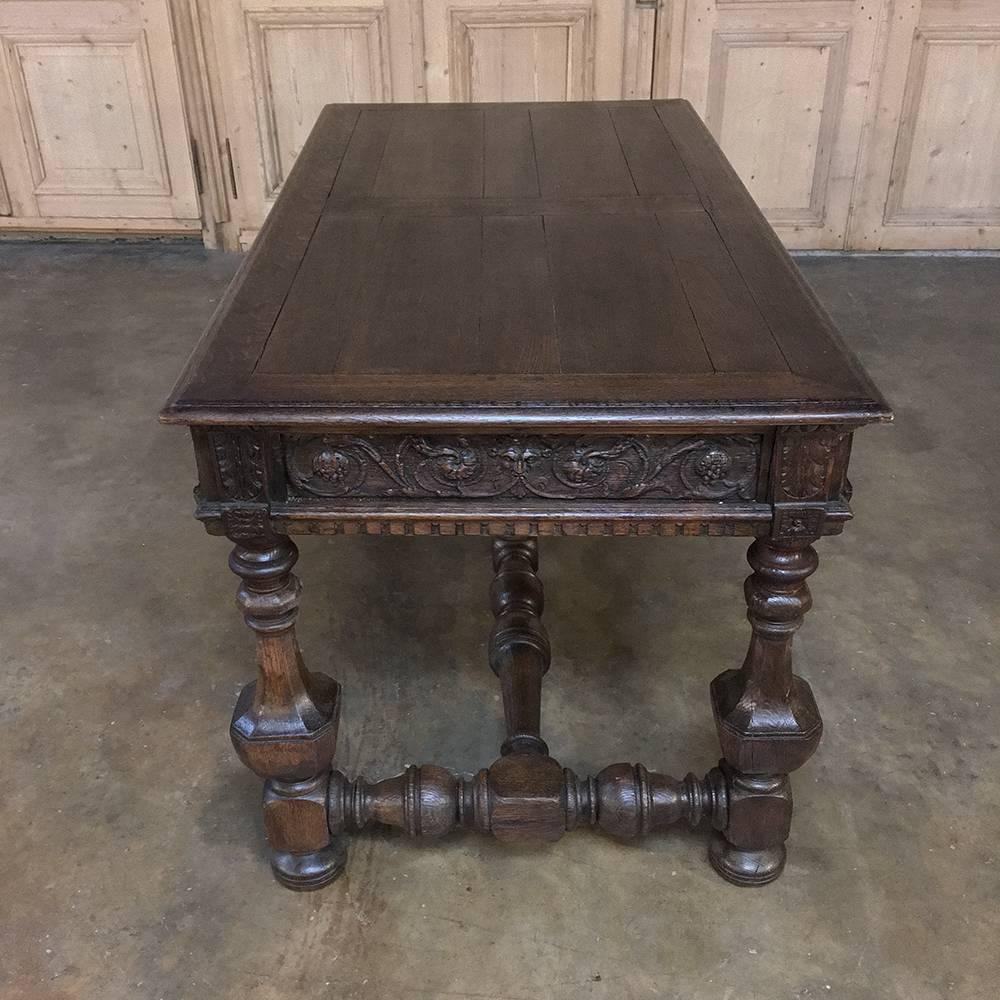 19th century Renaissance Revival desk features exquisite hand-carved detailing all around supported by turned columns and massive turned stretchers hand-crafted from old growth oak to last for centuries!
circa 1850s
Measures: 29.5 H x 60.5 W x 32