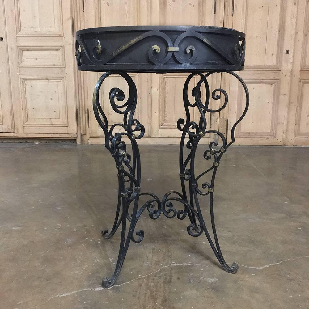 19th century wrought Iron Jardinière or planter box is the perfect way to display fresh greenery or flowers, or it can be used to serve iced bottled or canned beverages for entertaining,
circa early 1900s
Measures 35 H x 24.5 W x 19.5 D.