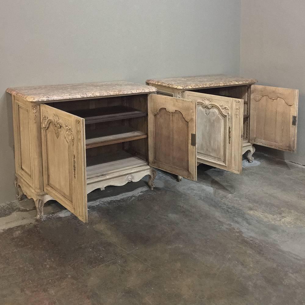 Pair of 19th century French Regence marble-top stripped oak buffets was sculpted from old-growth quarter-sawn oak to last for generations, and features a stately yet casual appearance partly due to the stripped finish giving a light and airy look.