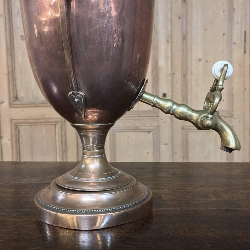 19th century copper and brass samovar, tea server is a wonderful testament to Old World craftsmanship, and features a Greek Amphora design which dates back to 3,000+ years, combined with the beginnings of the Art Nouveau style evident in the handle