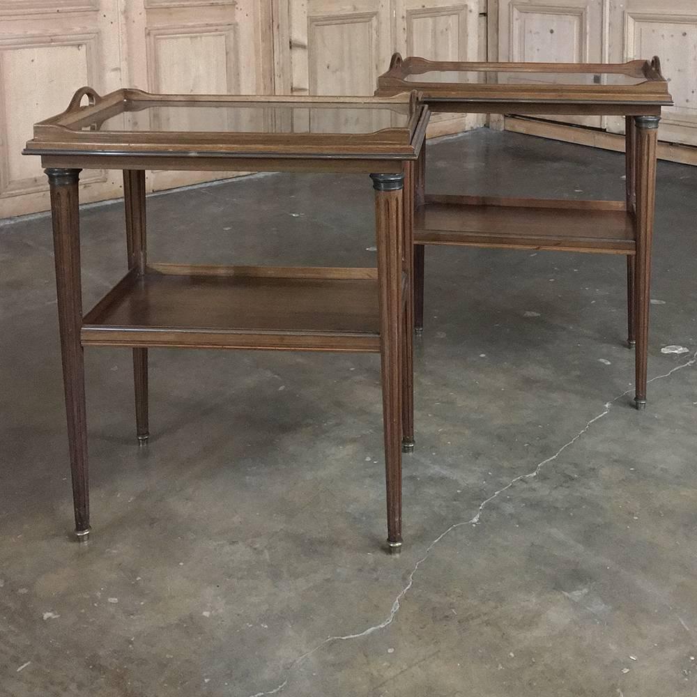 Pair or 19th century French Directoire tea serving tables were bench made from wonderful imported Mahogany, and are very rare to find in a matched pair, and perfect for any seating group, by the bedside, or in your entertaining room! Tops are
