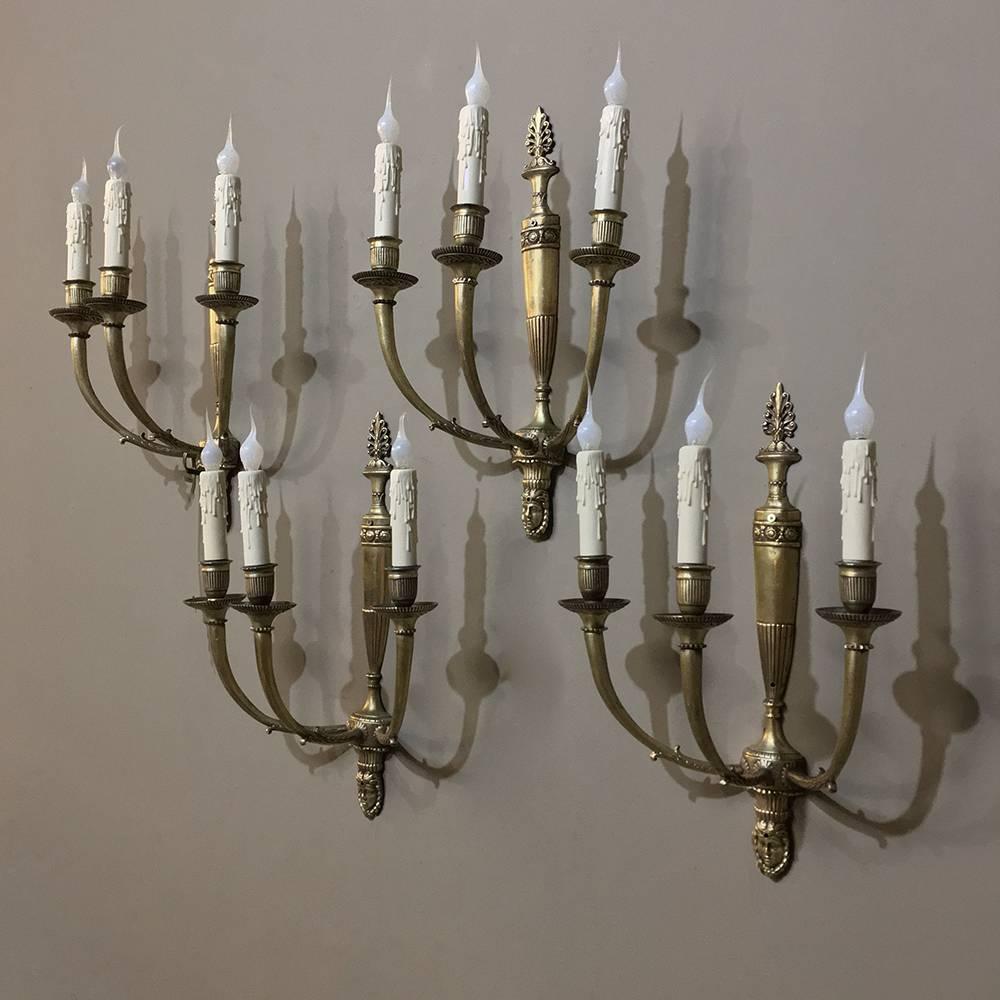 Late 19th Century Set of Four Antique French Empire Cast Bronze Wall Sconces, each with Three Arms