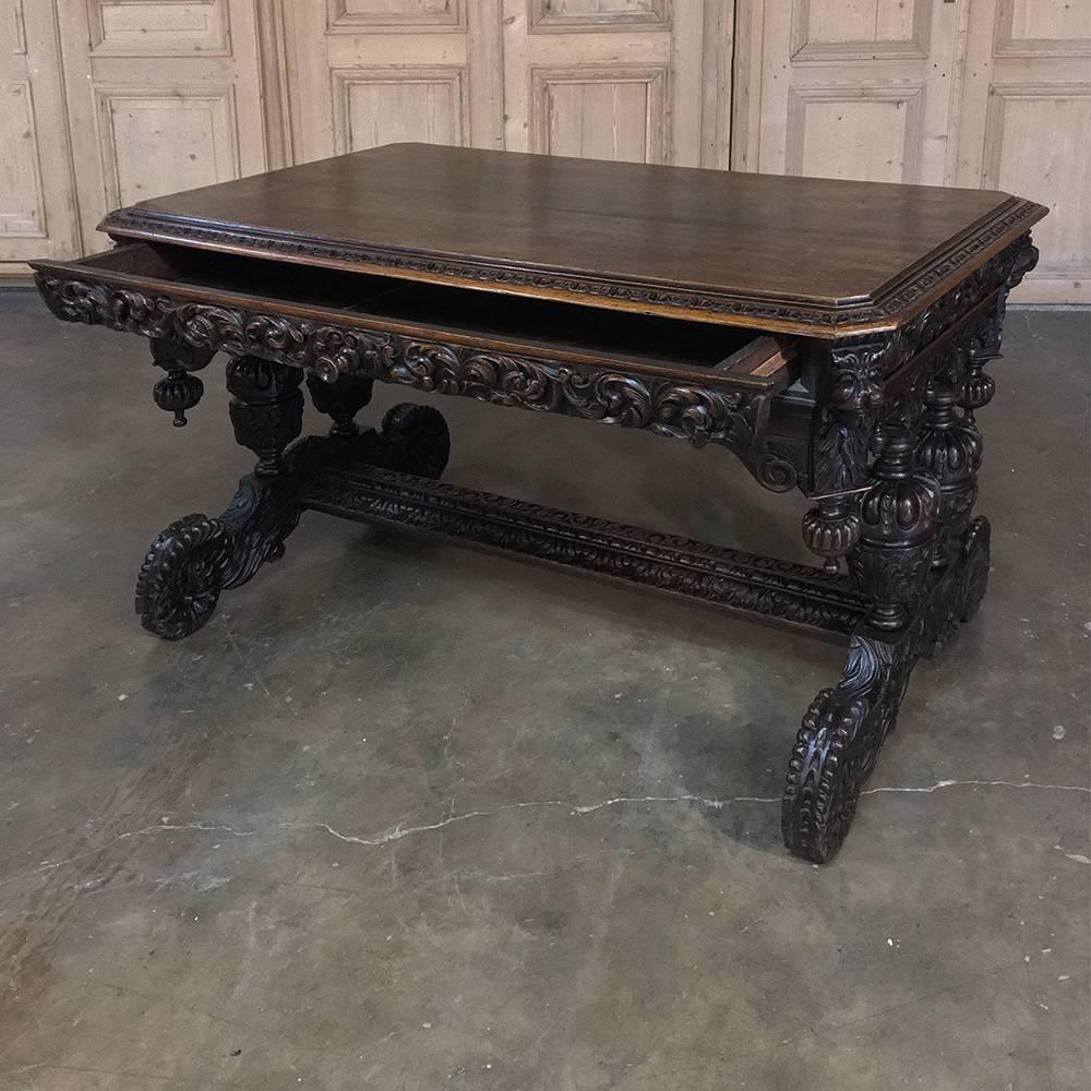 19th century French Renaissance desk with dolphins was boldly sculpted from dense, old-growth quarter-sawn oak to last for centuries! Carved on all surfaces save the top, it features elaborate Renaissance motifs in abundance, all of which must be
