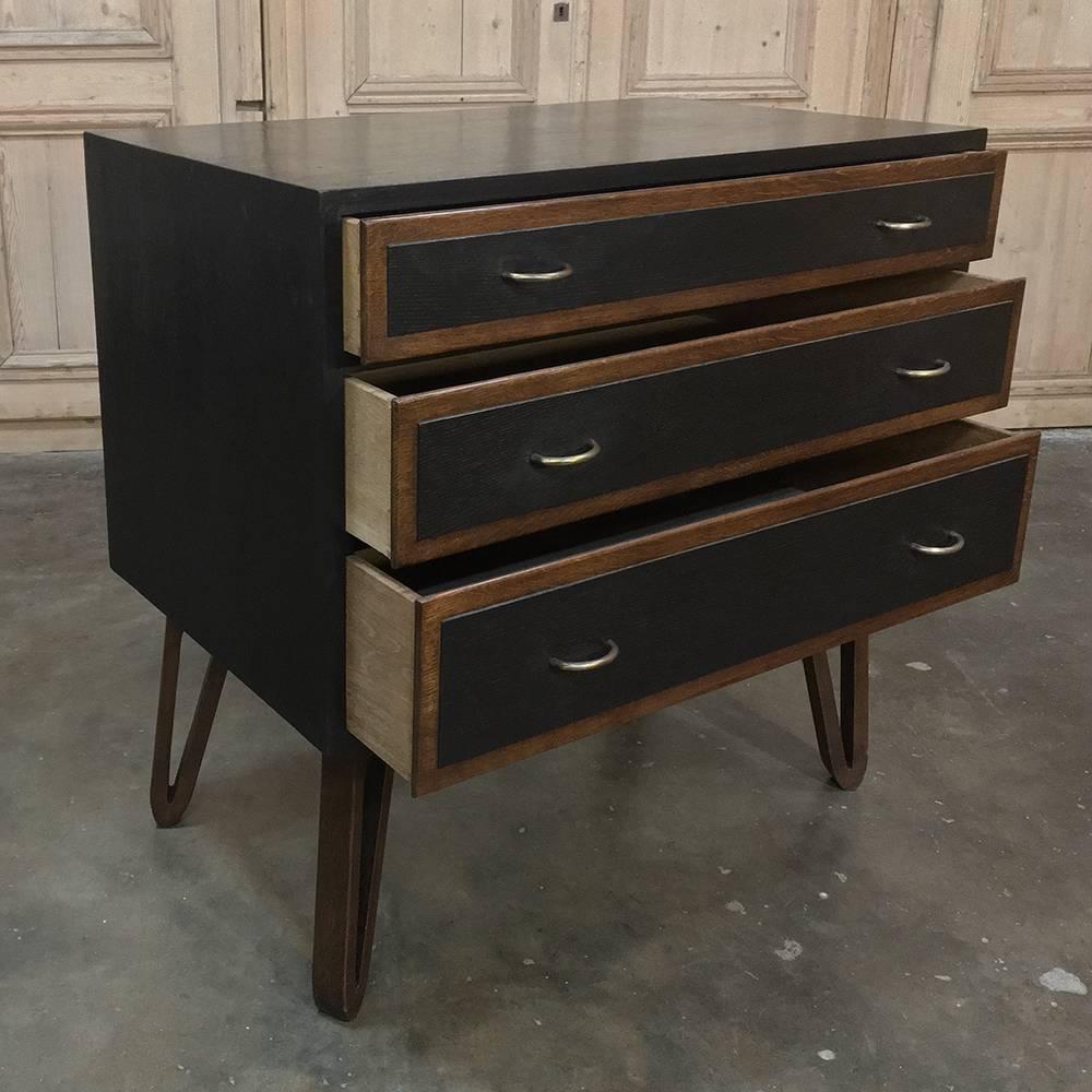Mid-Century Modern chest of drawers by Cees Braeckman is perfect for the contemporary style, and offers a modernist black finish accented with natural wood bordering for a wonderful visual effect. Quality joinery includes dovetails on the drawer