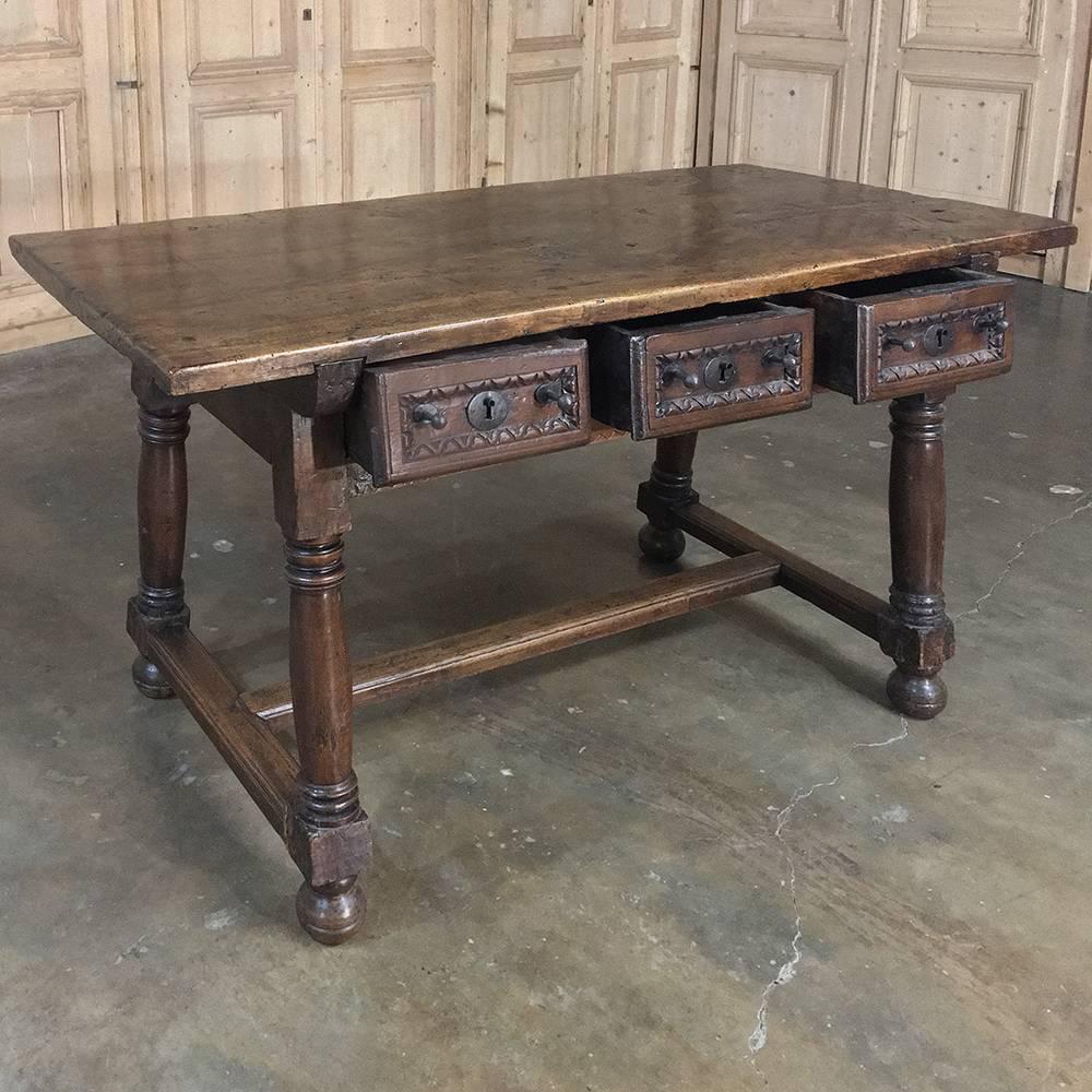 18th century Rustic Spanish walnut desk was meticulously handcrafted from old-growth walnut harvested from the foothills of the Pyrenees, and features a charming design rendered by rural artisans with what would today be considered rudimentary