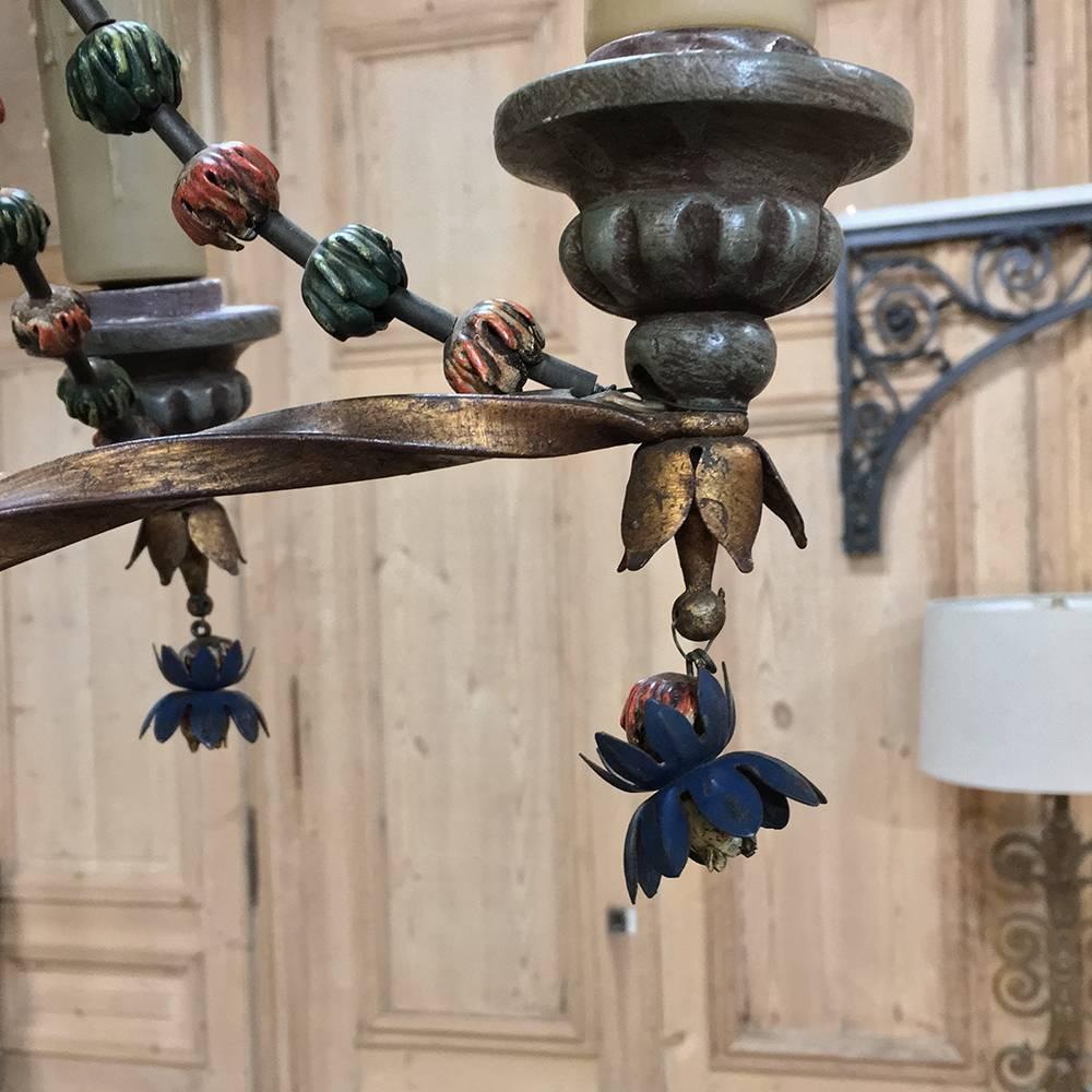 Antique Italian polychrome chandelier is a colorful way to add the ambiance and flair of antique lighting to any room! Although the colors are varied, they are wonderfully muted, and the design includes florals and foliates with a central