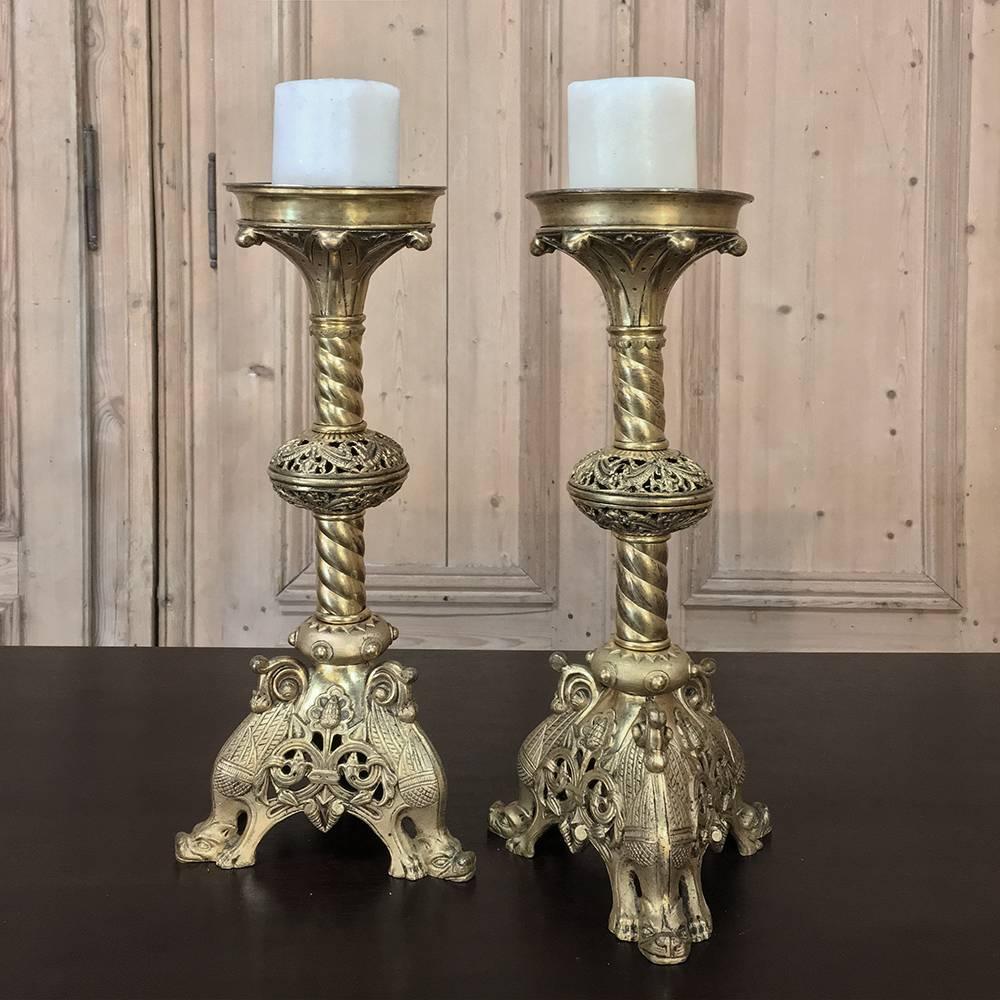 Pair 19th Century Bronze Gothic Candlesticks.

Handcrafted to an amazing degree of detail this pair of candlesticks retains its original sprickets, and features cast bronze bases, mid-sections and bobeches, with brass spiral fluted shafts,

Circa