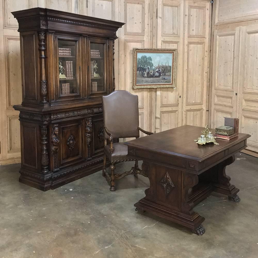 Antique Italian walnut neoclassical walnut bookcase is a masterpiece of architecture and embellishment! Completely handcrafted from the intriguing step-front crown to the boldly carved base that mirrors the profile above, it boasts a pair of