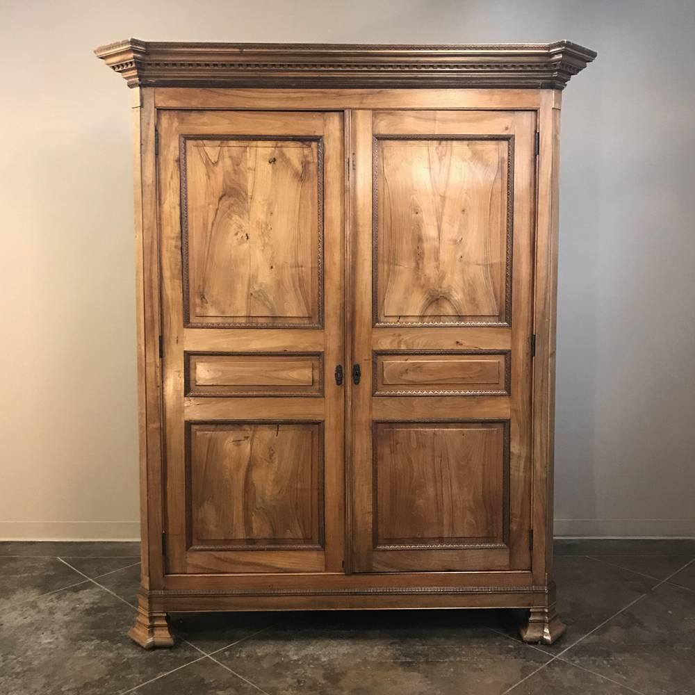 19th century French Louis Philippe walnut armoire represents the essence of purity of architecture, a design type that exemplifies the period! This example, rendered from Fine French walnut, features the Classic lines that have made the style