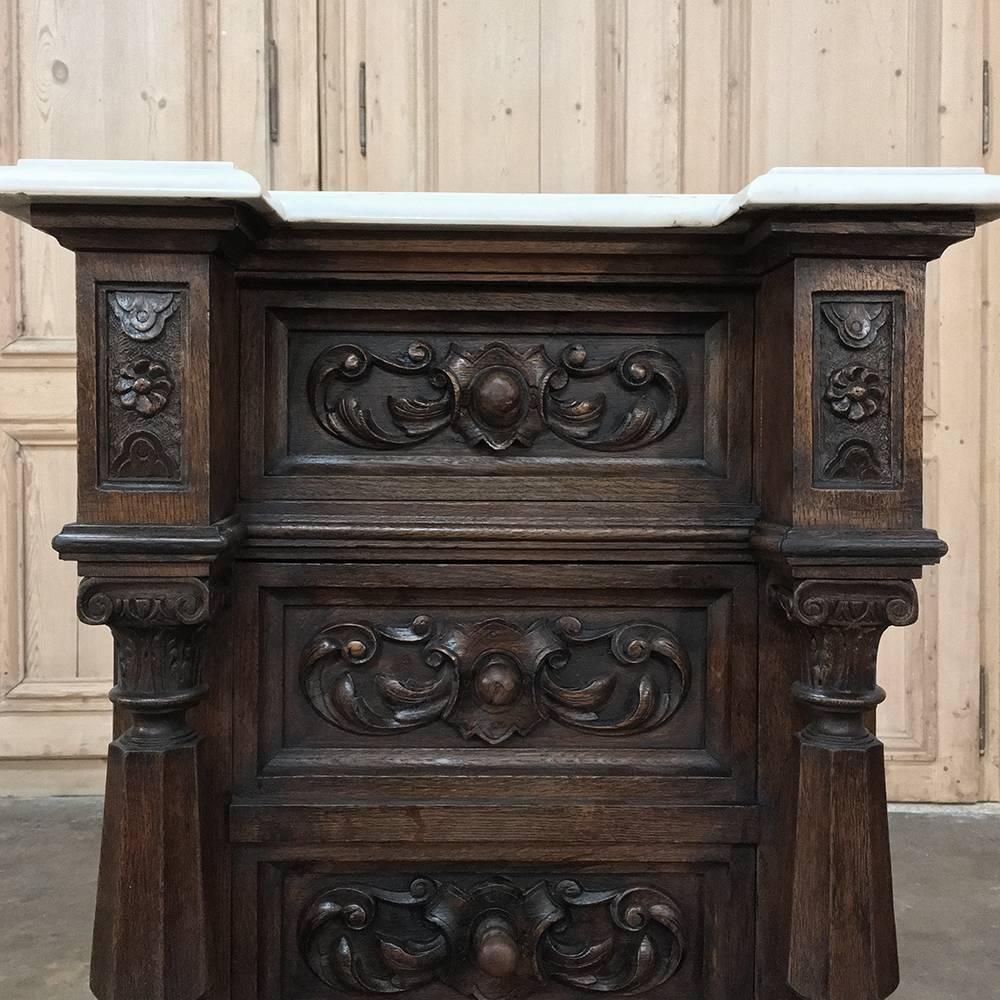 This stunning 19th century French walnut Henri II nightstand represents the epitome of the Revival of the Late Renaissance in France during the waning years of the Napoleon III period. Handcrafted using time-honored techniques and masterful