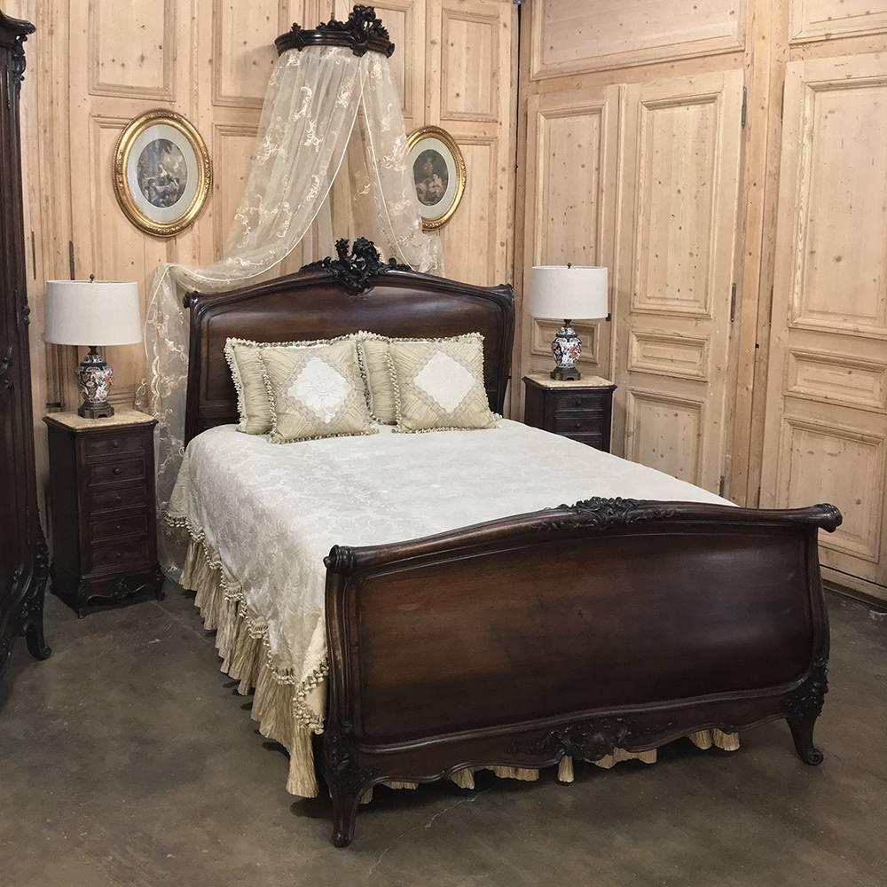 19th century French Louis XV walnut five piece bedroom suite consists of a Serpentine Armoire, Queen Sleigh bed, the original bed canopy and pair of nightstands! The only straight lines on the armoire are on the surfaces of the shelves inside,