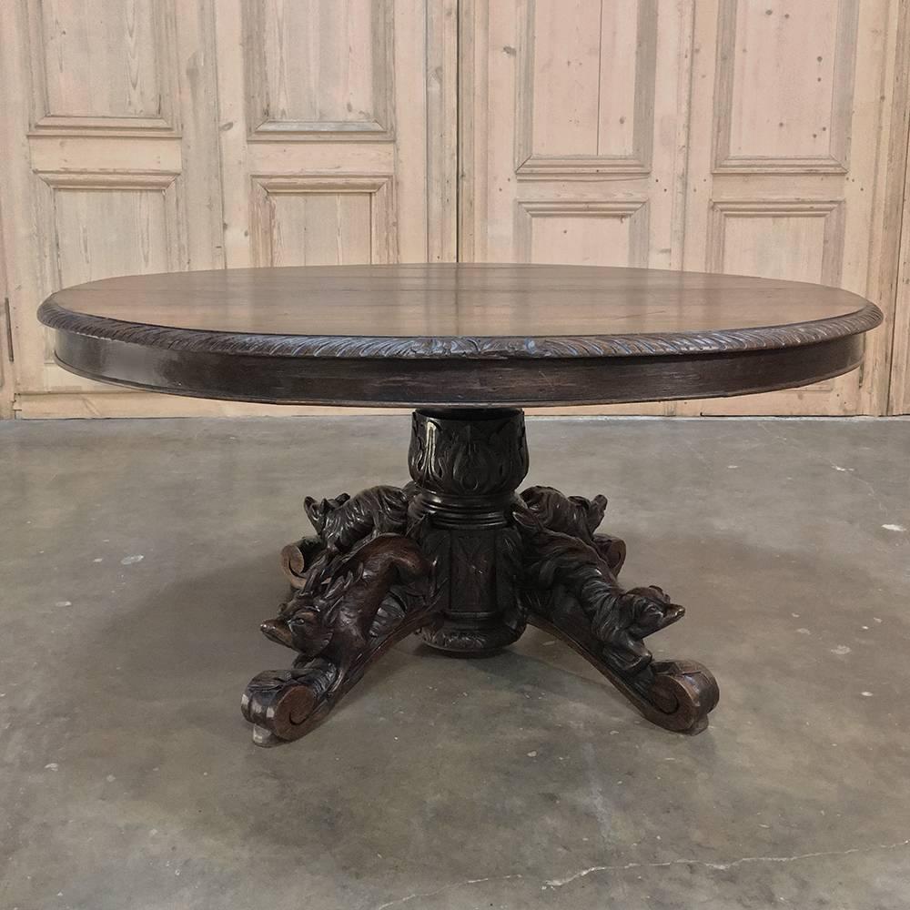 19th century French Hunt Style oval coffee table is a work of the sculptor's art, perfect for the masculine or nature-oriented decor! With four elaborately carved and scrolled legs topped with sculpted dog, boar, deer and fox, all rendered from
