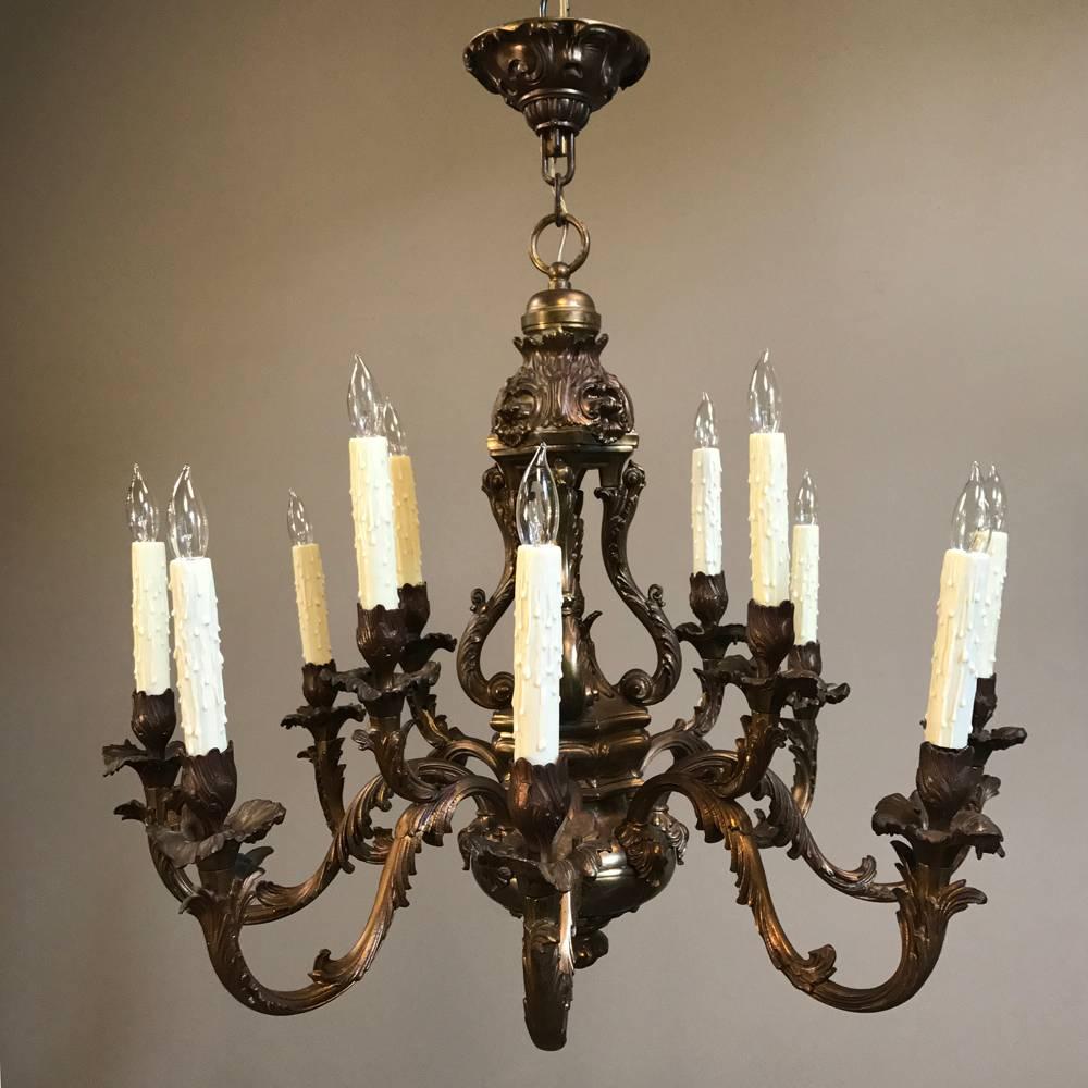 Antique French Louis XV brass chandelier is the ideal choice for adding timeless flair and simultaneously providing ambient illumination, all the while creating a focal point for the center of the room! Cast in incredible detail, it speaks to a