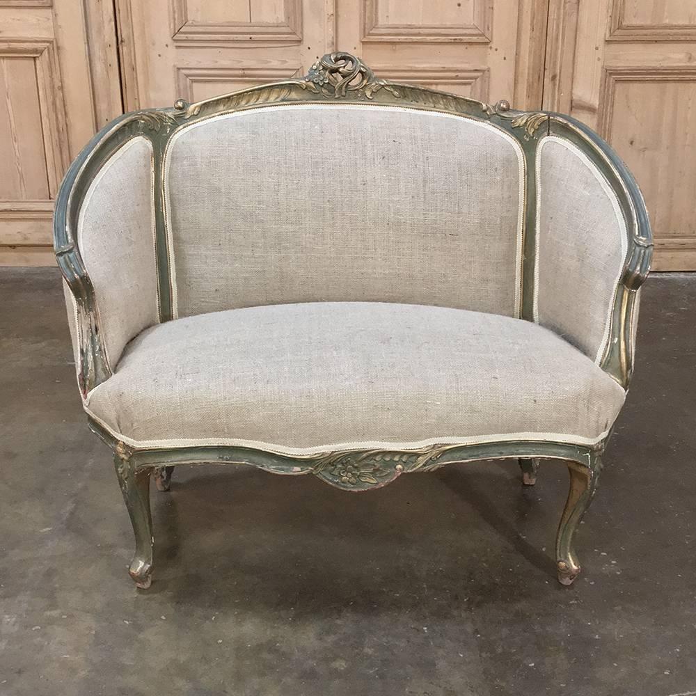 19th century Italian Rococo painted sofa with new upholstery makes the perfect choice for a cozy seating group, or to add to any room that needs a little comfort in style! Timeless, naturalistic Rococo styling was created in the framework,