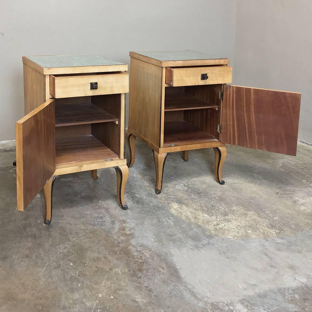 Naturally finished for a light effect, this Pair of Mid-Century French fruitwood nightstands feature ebonized bordering, glass tops, and surprising storage,
circa 1950
Each measures 31.5 H x 17 W x 15 D.