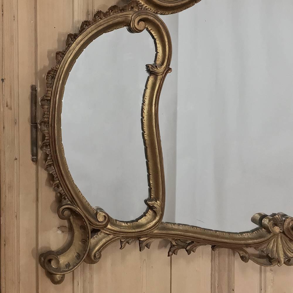 Antique Italian Baroque giltwood mirror is a masterpiece of the style, in hand-carved giltwood! Three panels with elaborately sculpted and contoured frame make an excellent choice for a short space over a tall fireplace mantel, or in the bathroom,