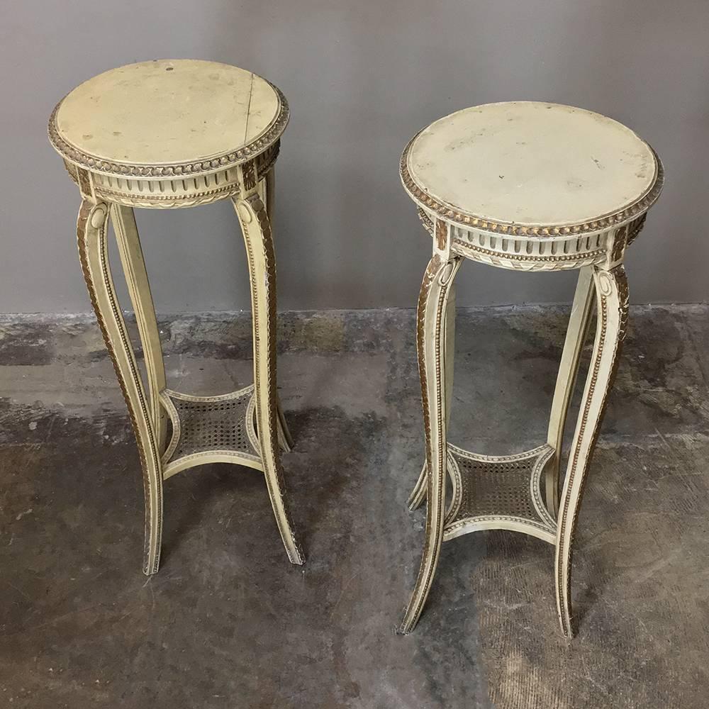 Pair of 19th century Italian neoclassical painted pedestals feature timeless lines inspired by ancient Greek and Roman architecture, with fluted apron and gracefully scrolled legs, all subtly hand-carved and finished in gold for an understated