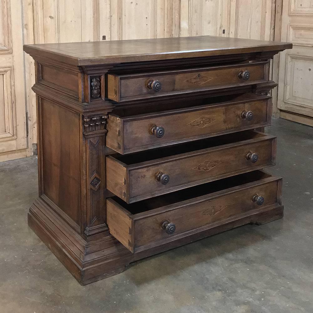 19th century grand Italian neoclassical walnut commode was designed for a large villa and features timeless Romanesque styling with four huge drawers flanked by fluted and carved pilasters on each corner. Bold molding above and below provide a