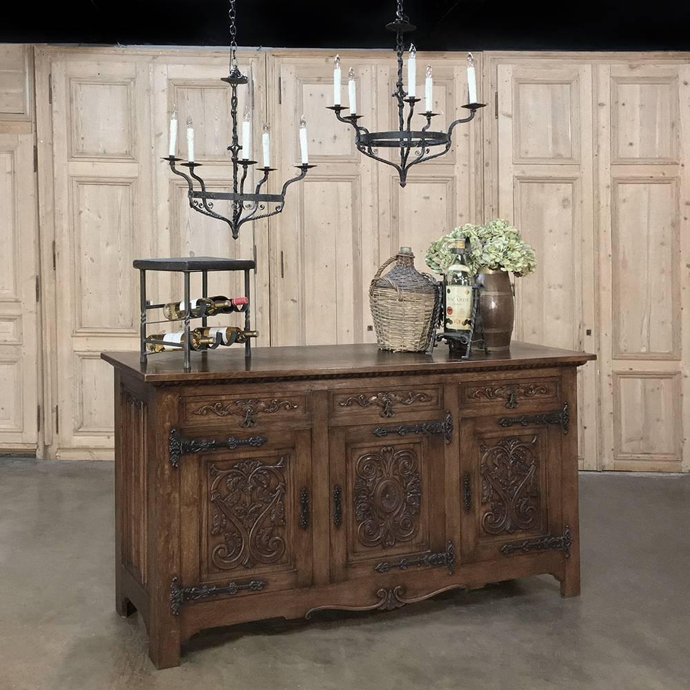 Pair of 18th century wrought iron country Spanish chandeliers are not only rare to find, they're even more delightful to own! Originally fashioned for candles, each one was fashioned from red-hot iron by a talented blacksmith who added subtle