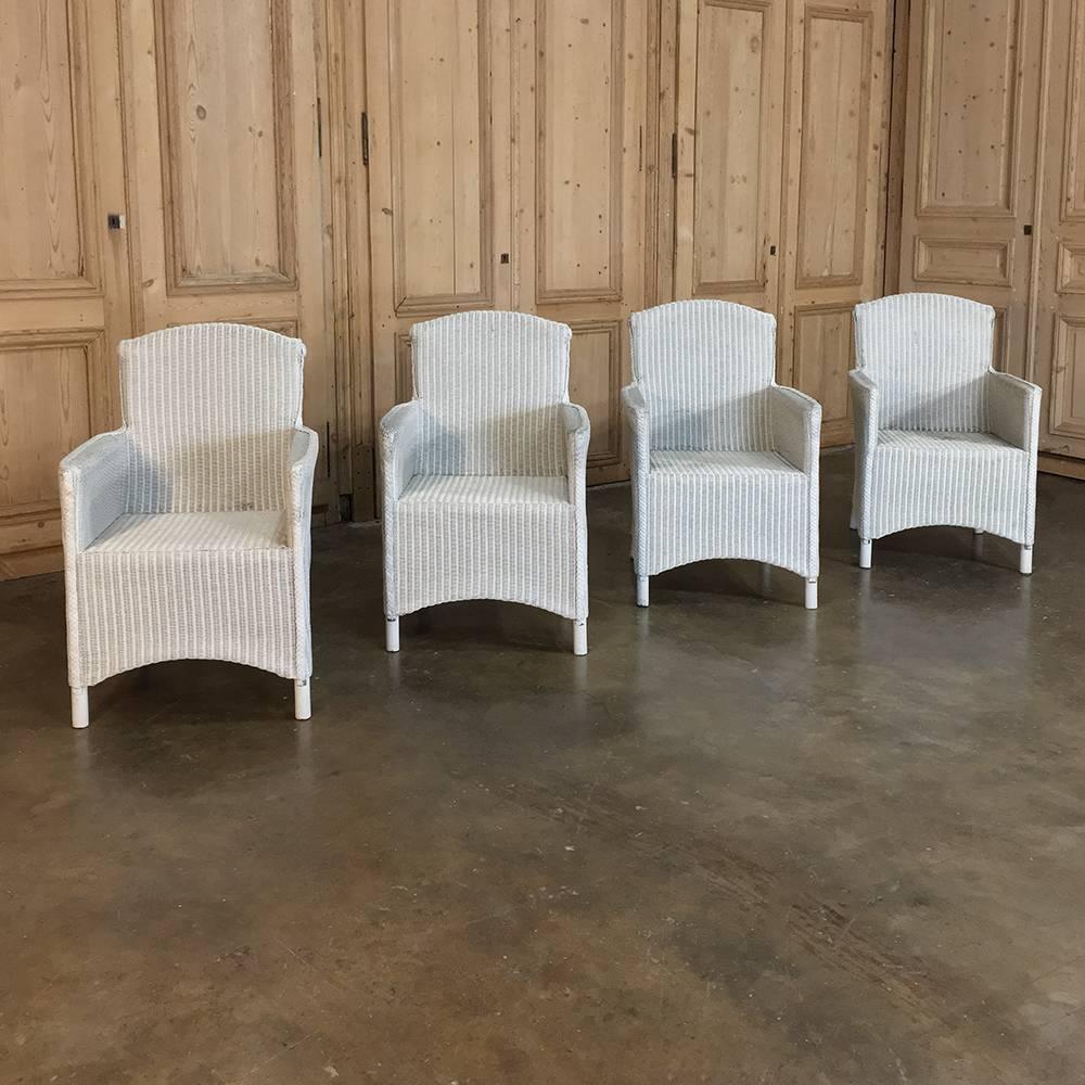 Set of four antique Lloyd Loom armchairs were considered the highest quality in their prime, and this set of four armchairs explains why! Light in weight yet extraordinarily comfortable, they were popular in casual decors, sun rooms, and the like.