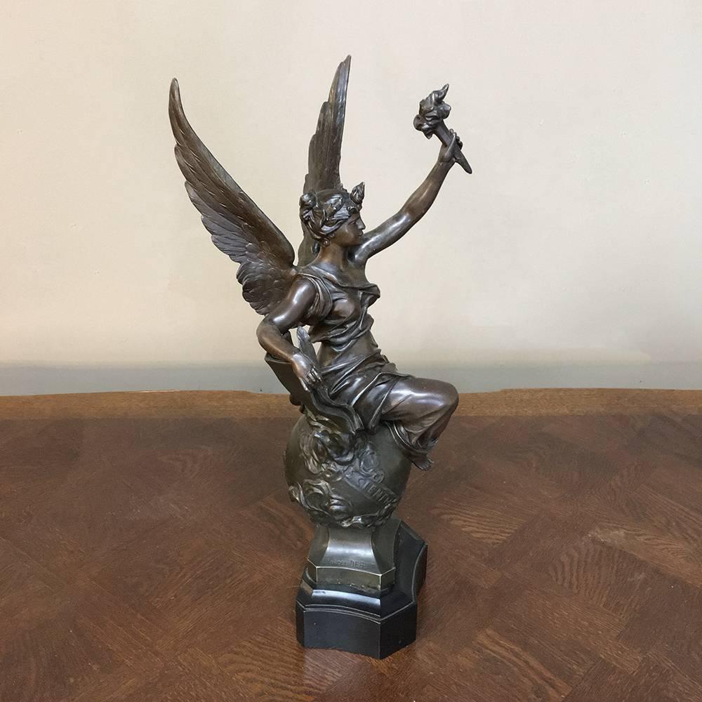 This antique spelter statue of angel was sculpted by Marcel Debut (1865-1933) and is - Entitled -Science. 

The son of the famous French 19th century sculptor Didier Debut. Marcel studied under Henri Chapu at the Ecole des Beaux Arts in Paris. He