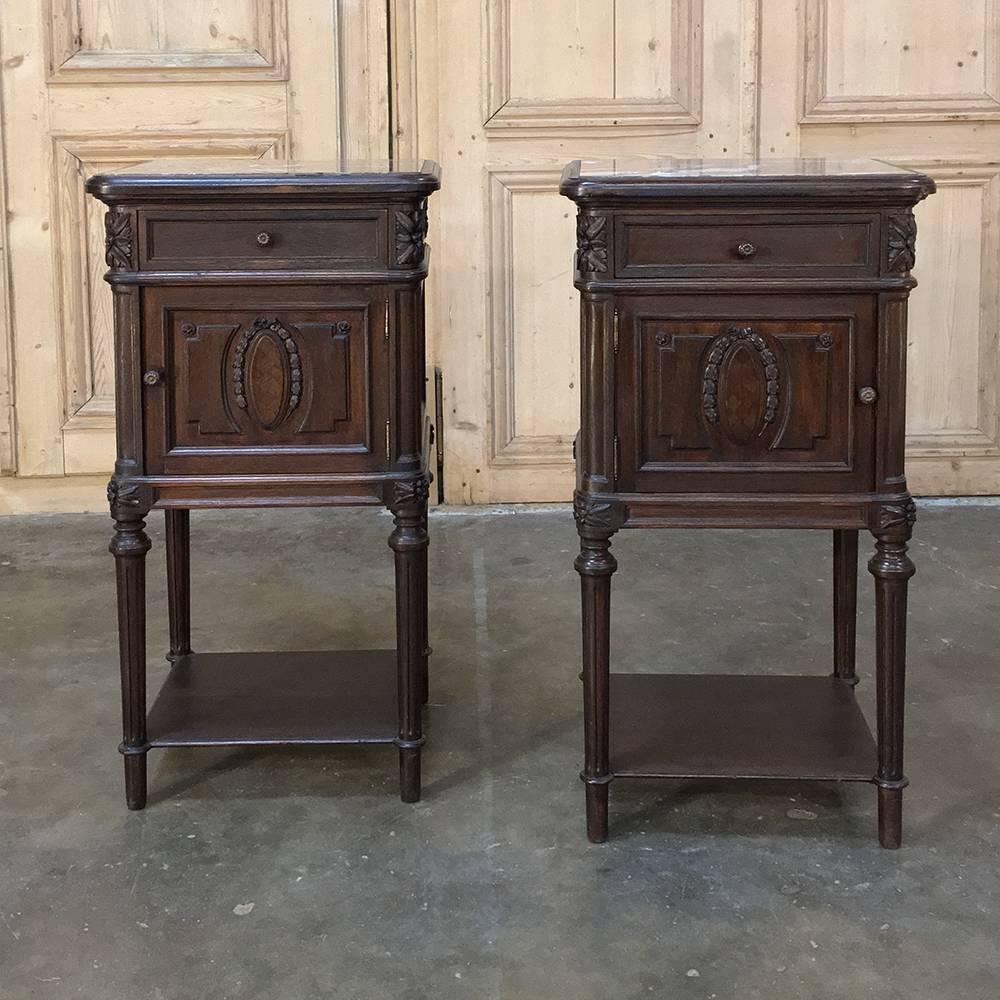 Pair of 19th century marble-top neoclassical nightstands with ceramic liners in the cabinets feature classic lines executed in fine French walnut, plus the convenience of the marble top and a lower shelf which adds to the drawer and cabinet space