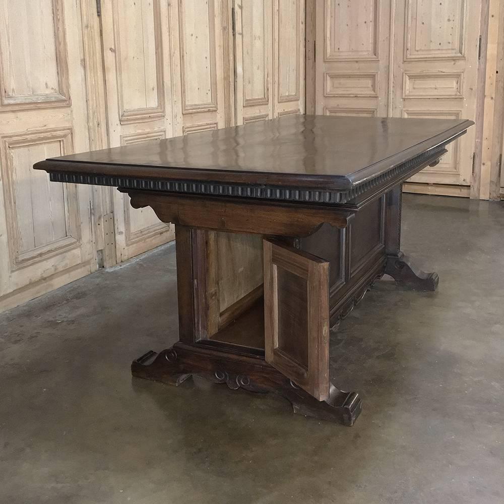 Antique Italian neoclassical walnut executive desk. Table is equally adept as a spacious desk or as a conference table, or a spectacular library table! Classic lines include Romanesque styling with subtle scrolling across the bottom and on the legs,