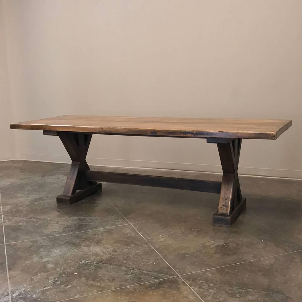 Antique Rustic Country French trestle table features a time-honored design that dates back at least a couple thousand years! This example, rendered in thick planks of solid, old-growth oak, ensures it will last for generation after generation to