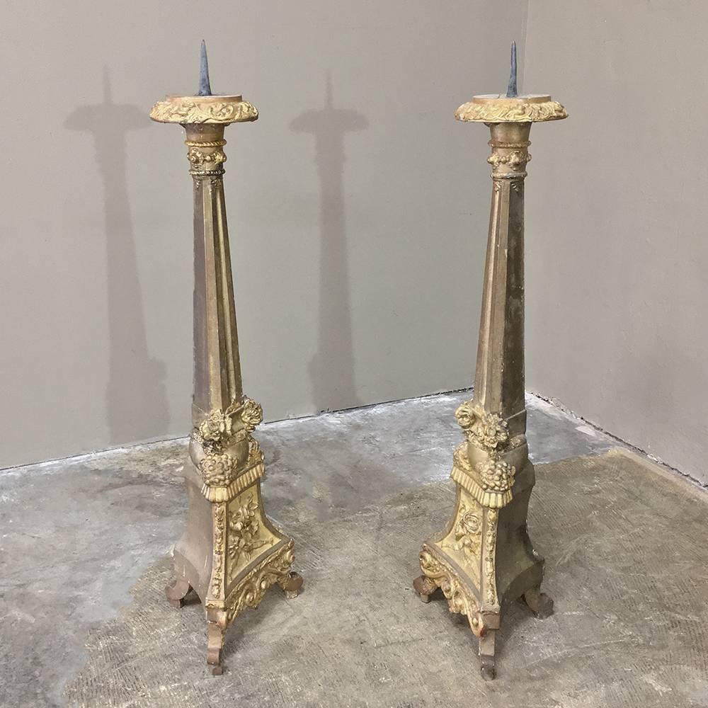 Pair of 19th century Italian giltwood candlesticks feature amazing hand-carved detail with a lovely patinaed gold finish that is truly timeless!
circa 1870s
Each measures 37.5 H x 11 W x 9 D.