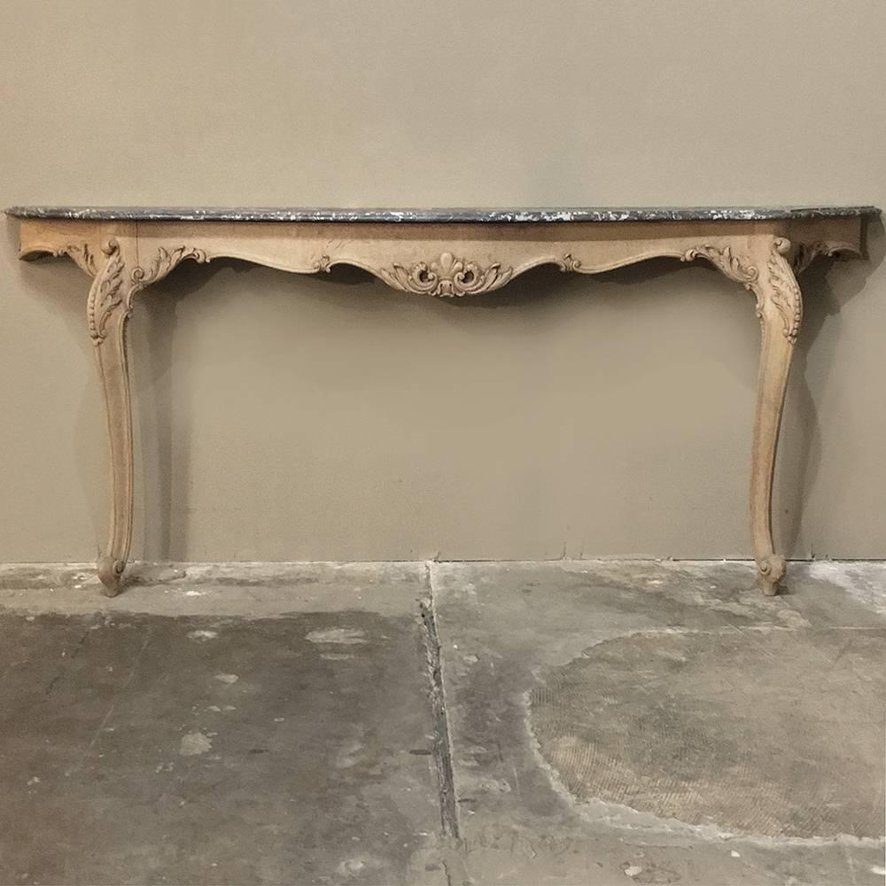19th century Grand French Regence stripped oak grey marble top console is as unusually wide as it is unusually shallow! Over seven feet in width, it protrudes out from the wall barely a foot! Exquisitely contoured, scrolled and hand-carved solid oak