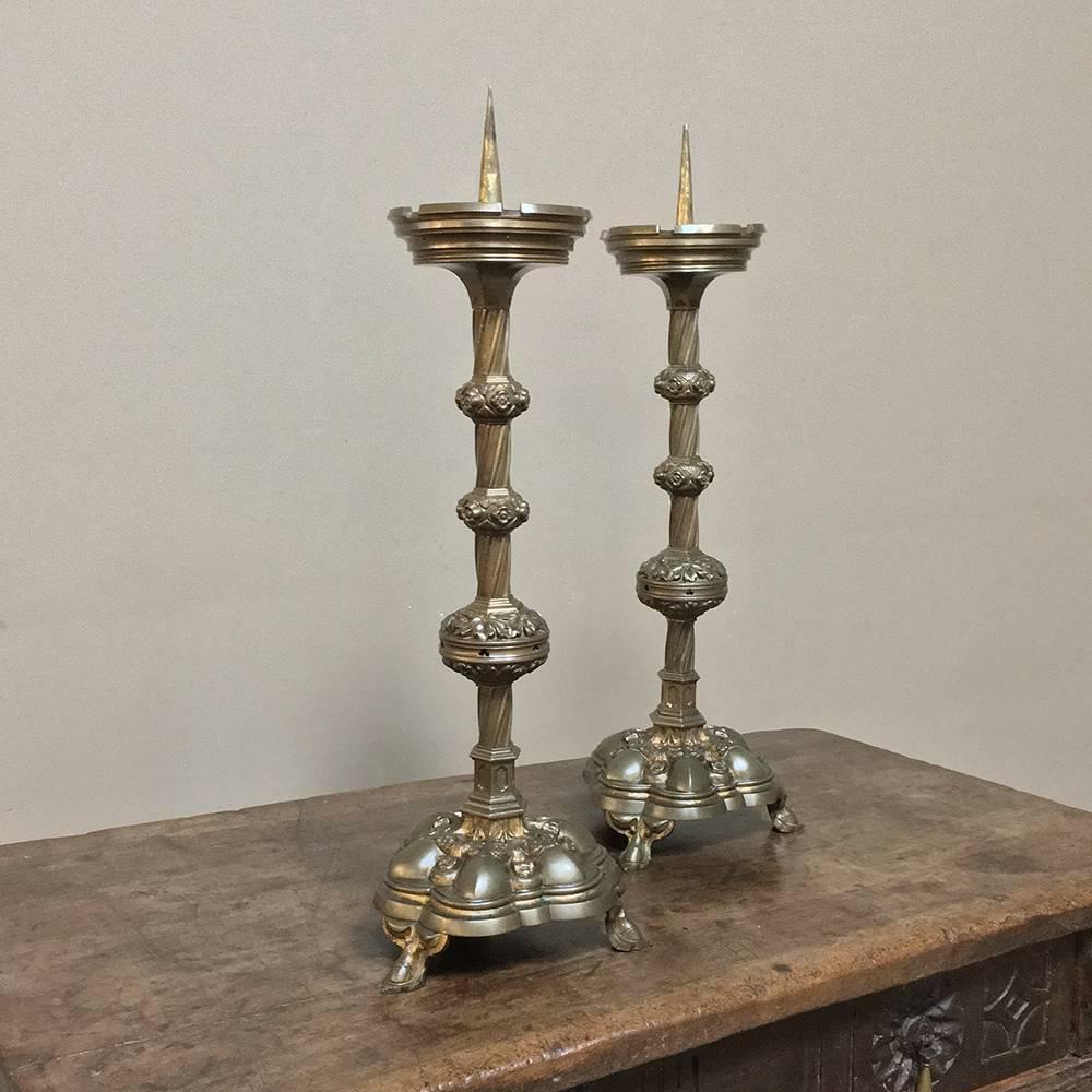 Pair of 19th century, French Gothic brass candlesticks feature remarkable detail and intricate styling that includes a scalloped footed base with the original sprickets on top.
circa 1870s
Each measures 20.5 H x 8 in diameter.