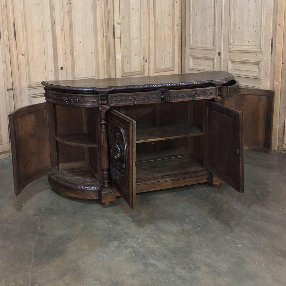 19th century French Renaissance hunt buffet features amazing sculptures in glorious full relief on each of the four cabinet doors, depicting the bounty of the grape harvest on one, the wheat harvest on the other (which together also represent bread