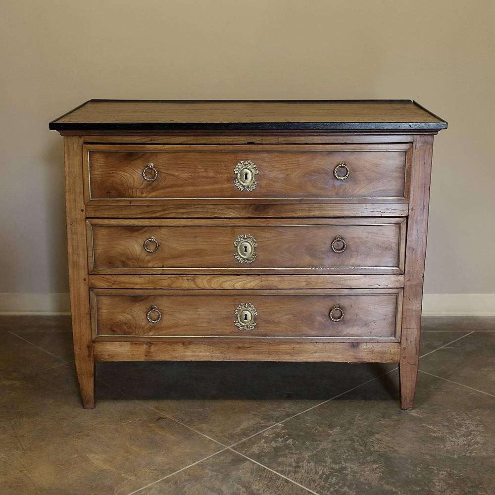 Early 19th Century French Louis XVI Fruitwood Commode was made from old growth wild cherrywood, which gives it its marvelous color and hardness, making it easy to understand why this indigenous French wood has been one of the most favorite furniture