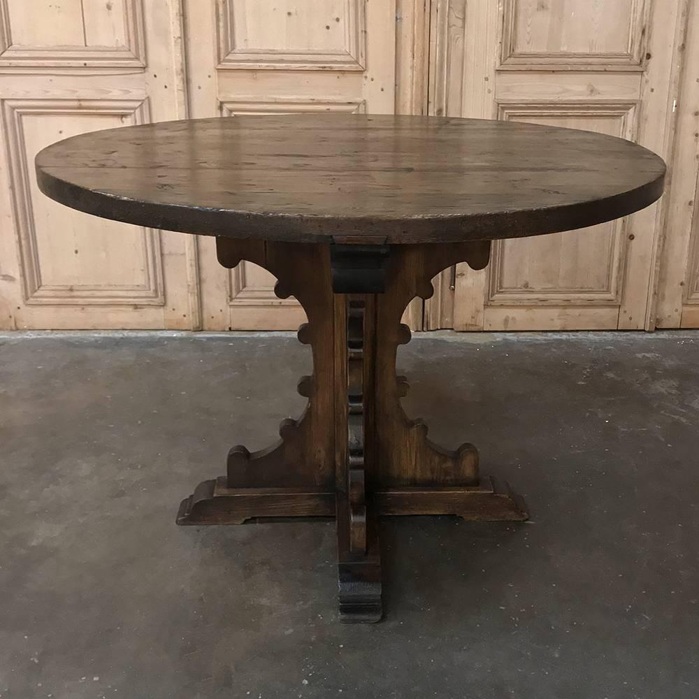 19th century Gothic pine centre table is perfect as a breakfast or game table, too! Subtle lines make it a great choice for the rustic decor, with thick planks of patina pine being used for the top and the pedestal below, negating the necessity of