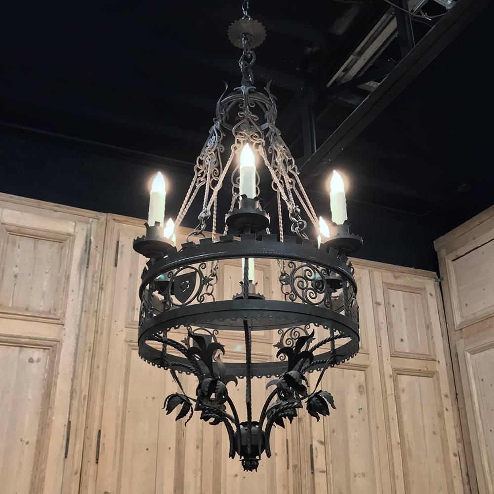 Antique Italian wrought iron chandelier will definitely command attention the minute one walks into the room! Hand-forged to an amazing degree of detail, it will add an unforgettable ambiance to any home or office.
Price includes standard