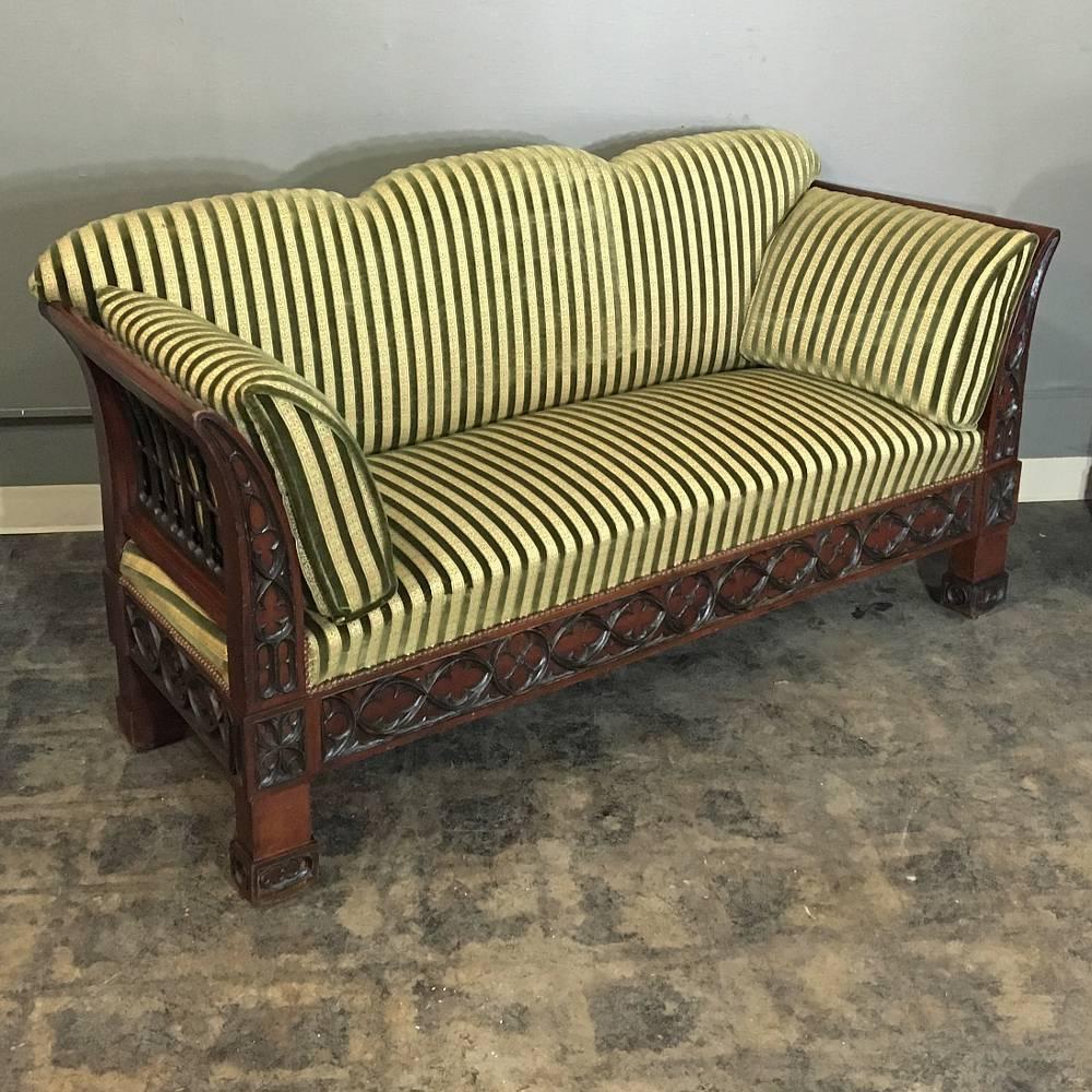 Providing exceptional comfort with a unique style, this 19th century Biedermeier Gothic Revival mahogany sofa is a paragon of fine craftsmanship that is so difficult to find today! Upholstery is in exceptional condition, and it works very well with