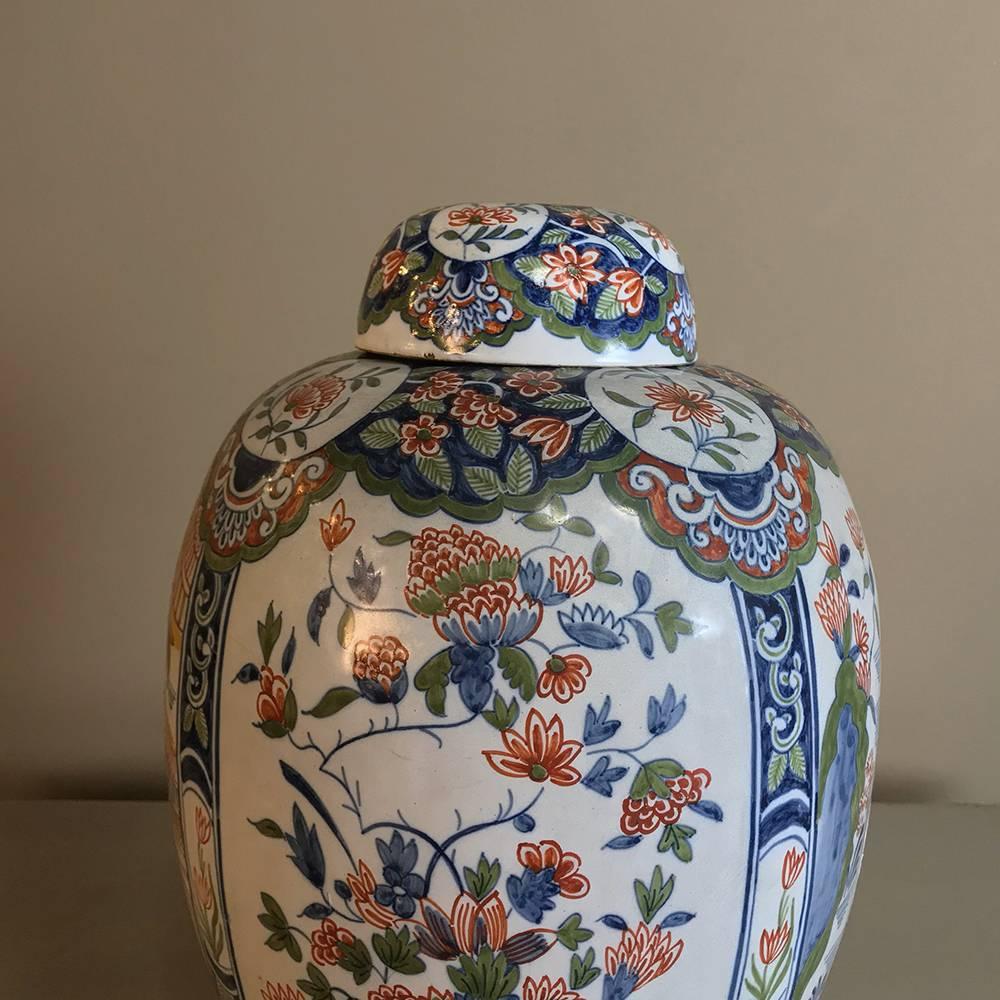 19th century oriental style delft vase with lid is a splendid example of Western European porcelain makers trying to keep up with the craze for oriental fine China that started in the 18th century and continues until this day! This example, rendered