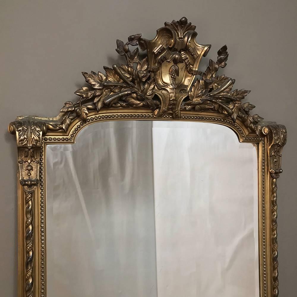 Grand 19th century French Baroque gilded mirror brings the majesty and grace of the Napoleon III period to your room, with the reflection of ambient light pervading the space bringing warmth and beauty for you and everyone who enters to appreciate!
