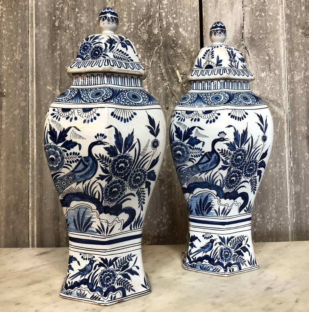 Pair of 19th century blue and white delft oriental style vases are a splendid example of Western European fine artisanry imitating the oriental designs that were so popular in the 18th and 19th centuries on the Continent, complete with vivid blue
