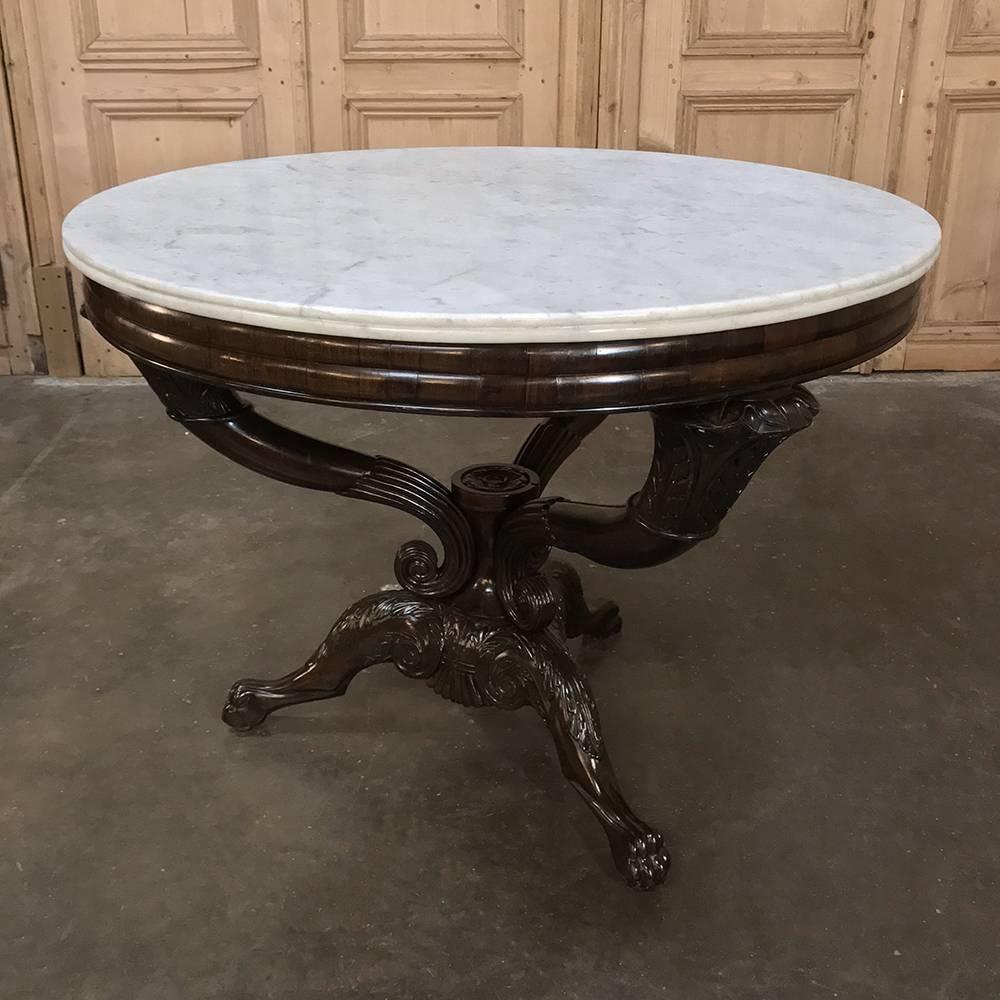 Mid-19th century rosewood and Cararra Marble Genovese center table is a masterpiece of the woodworker's art, being crafted from the exotic and rare rosewood that was imported from the Americas during the middle of the 19th century to Europe's finest