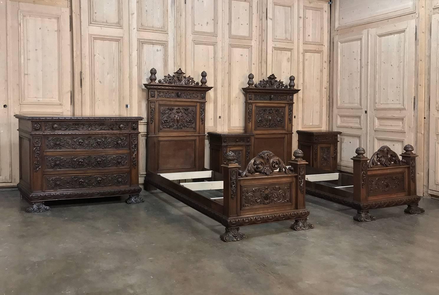 Pair of 19th century Italian renaissance walnut beds represent the essence of the style with elaborately carved bas relief and full relief naturalistic motifs across the entire visible facades of the head and footboards, even on the scrolled feet