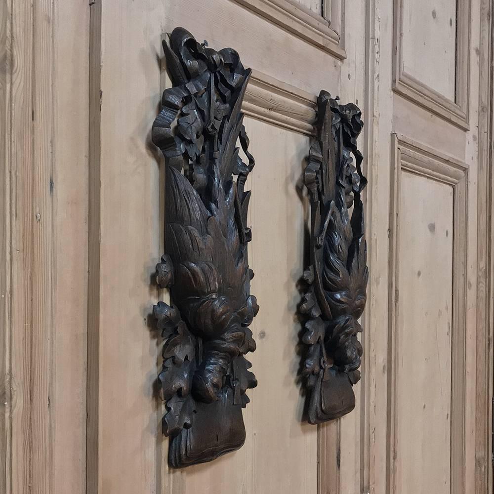 Sculpted from solid blocks of fruitwood, this pair of 19th century Black Forest game carvings exhibit remarkable detail in the plumeage of the doves, the ribbon, and oak leaves surrounding the work,
circa 1860s
Each measures: 20 H x 7.5 W.