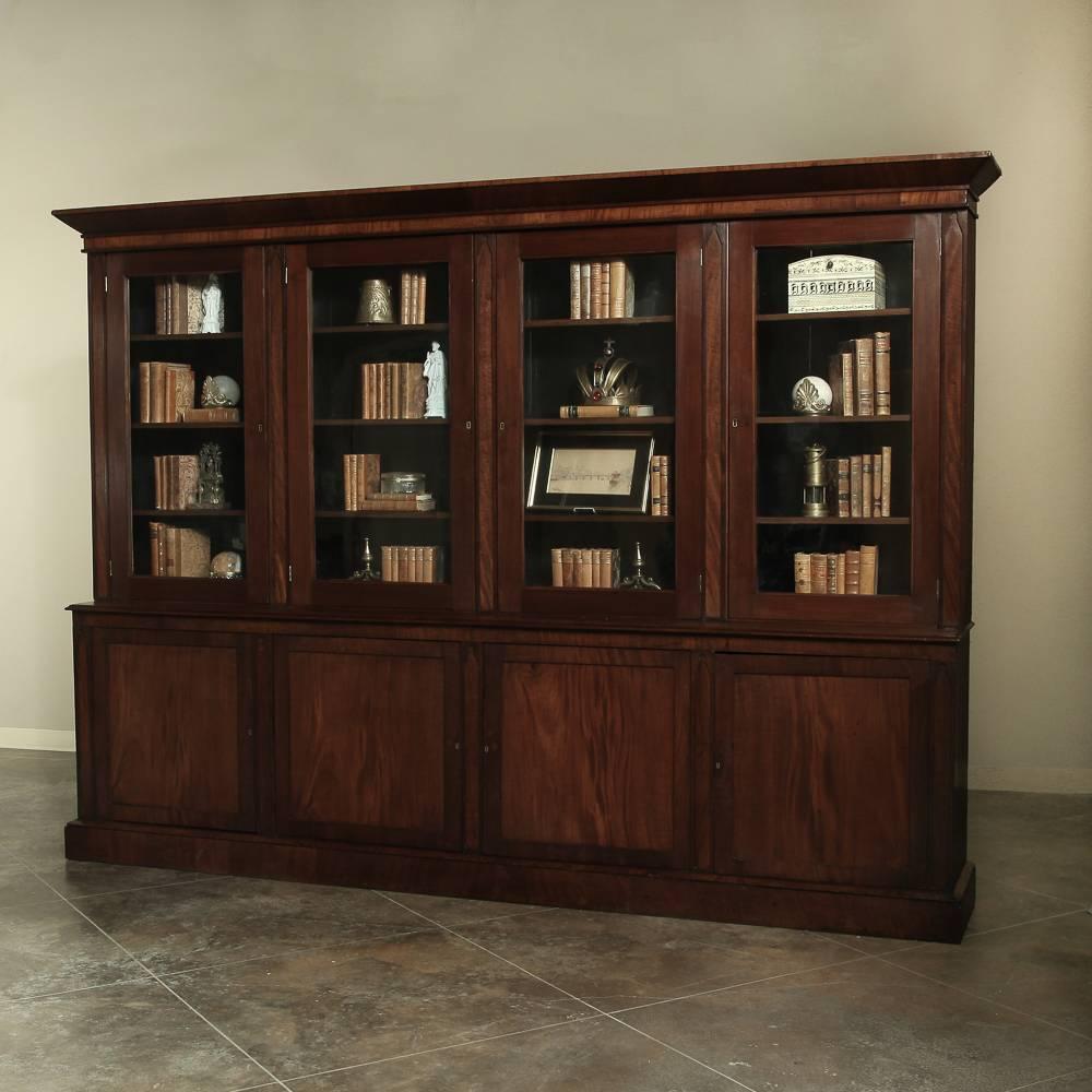 19th century grand Louis Philippe bookcase stretches over ten feet in width and almost eight feet in height! Handcrafted from old-growth solid French cherrywood to last for centuries!
circa 1850s.
Measures 91.5 H x 122 W x 18 D.

Inessa