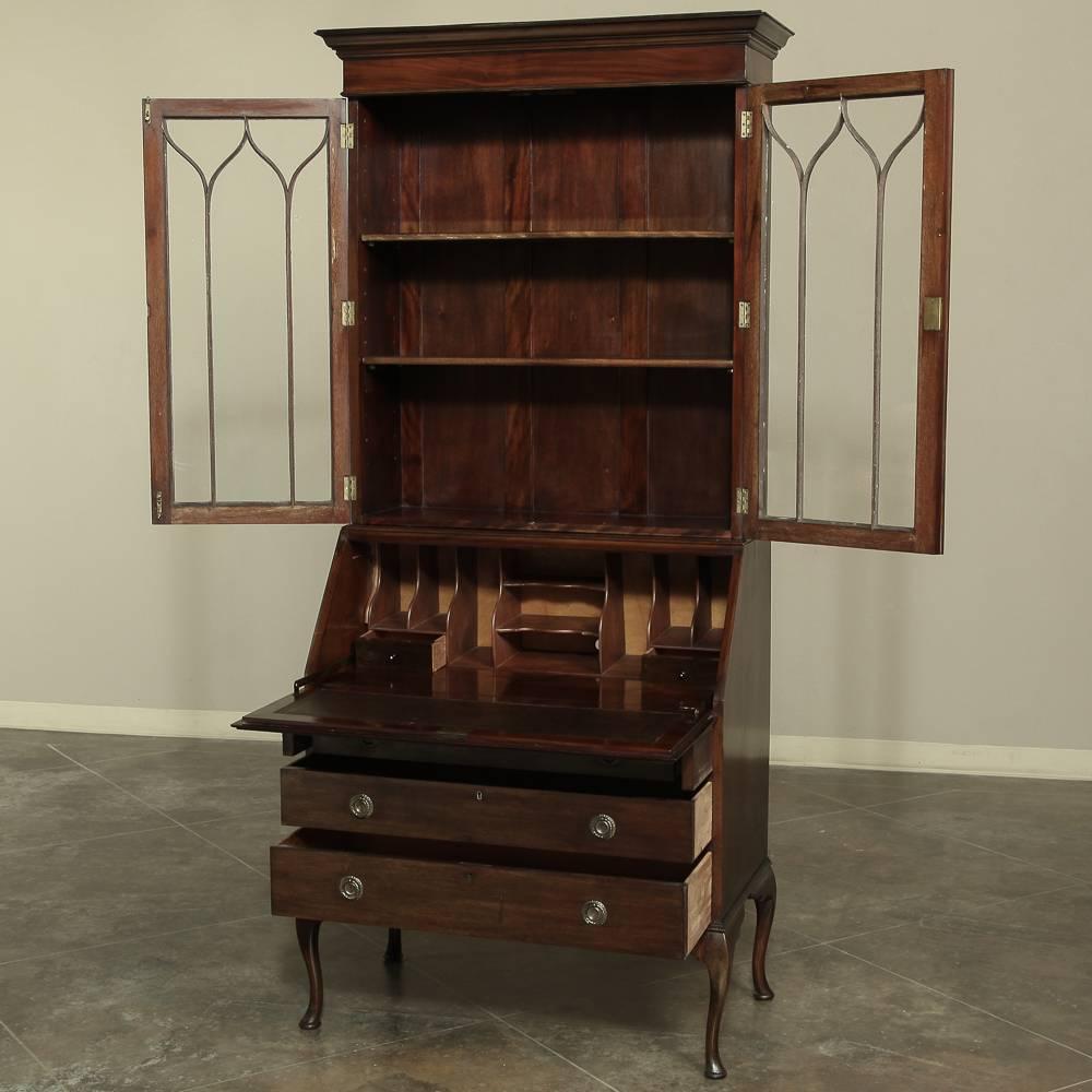 An elegant antique English mahogany secretary bookcase features glazed Gothic influence display above with a drop-front writing surface and drawers for storage all rendered in exotic imported mahogany!
circa 1900-1910.
Measures: 83 H x 38 W x 19.5
