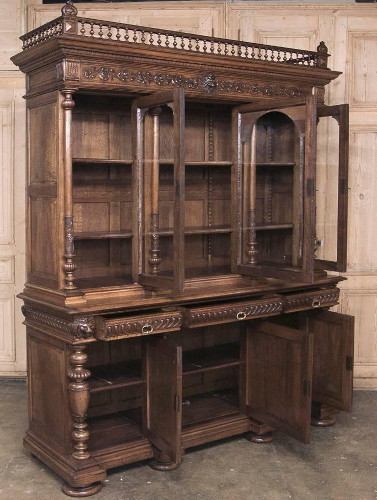 Stunning and grand 19th century French walnut Renaissance bookcase from Lyon was rendered from select walnut by master artisans and is an exceptional example of antique furniture of which anyone would be proud! A masterpiece of the woodsculptor's