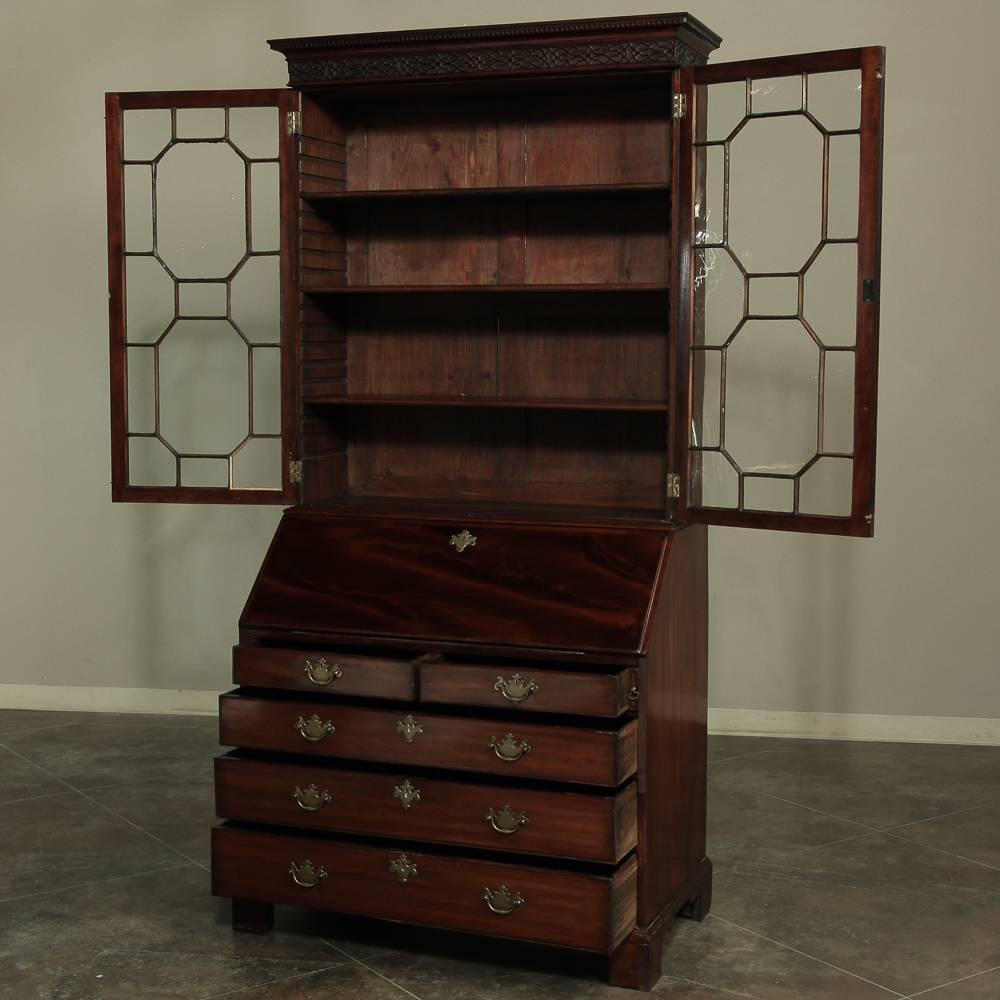 19th century Mahogany English secretary by  bookcase by Thomas Wilson (1799–1854) was beautifully handcrafted from exotic imported mahogany which creates the primary visual impact of this stately piece! Solid brass drawer pulls and key guards add a