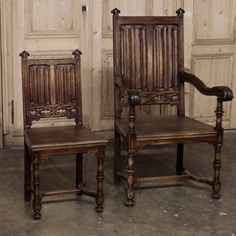 Set of six 19th century French Gothic dining chairs includes two armchairs! Handcrafted from old-growth French oak to last for decade after decade, each has been embellished with timeless hand-carved detailing for a Classic Old World look.
circa