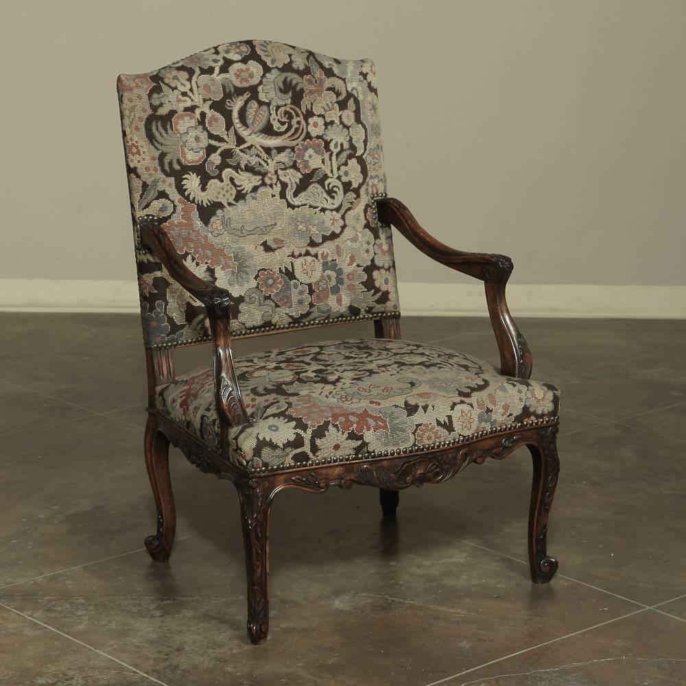Gorgeous large-scale 19th century antique French Louis XV armchair or fauteuil with original rich textured chinoiserie motives needlepoint tapestry upholstery, in browns, rust, sage and soft blues. The patina on solid walnut Rococo hand-carved frame