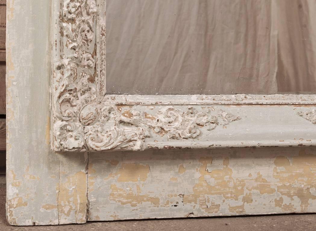 Exuding the ancient ambiance that only original patina and distress can provide, this splendid Antique Louis XVI Neoclassical Painted Trumeau features a wonderful original painted finish that has achieved an incredible look over the past century!